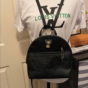 Black Embossed Monogram Backpack. Closet clearout no returns.  With lock and key